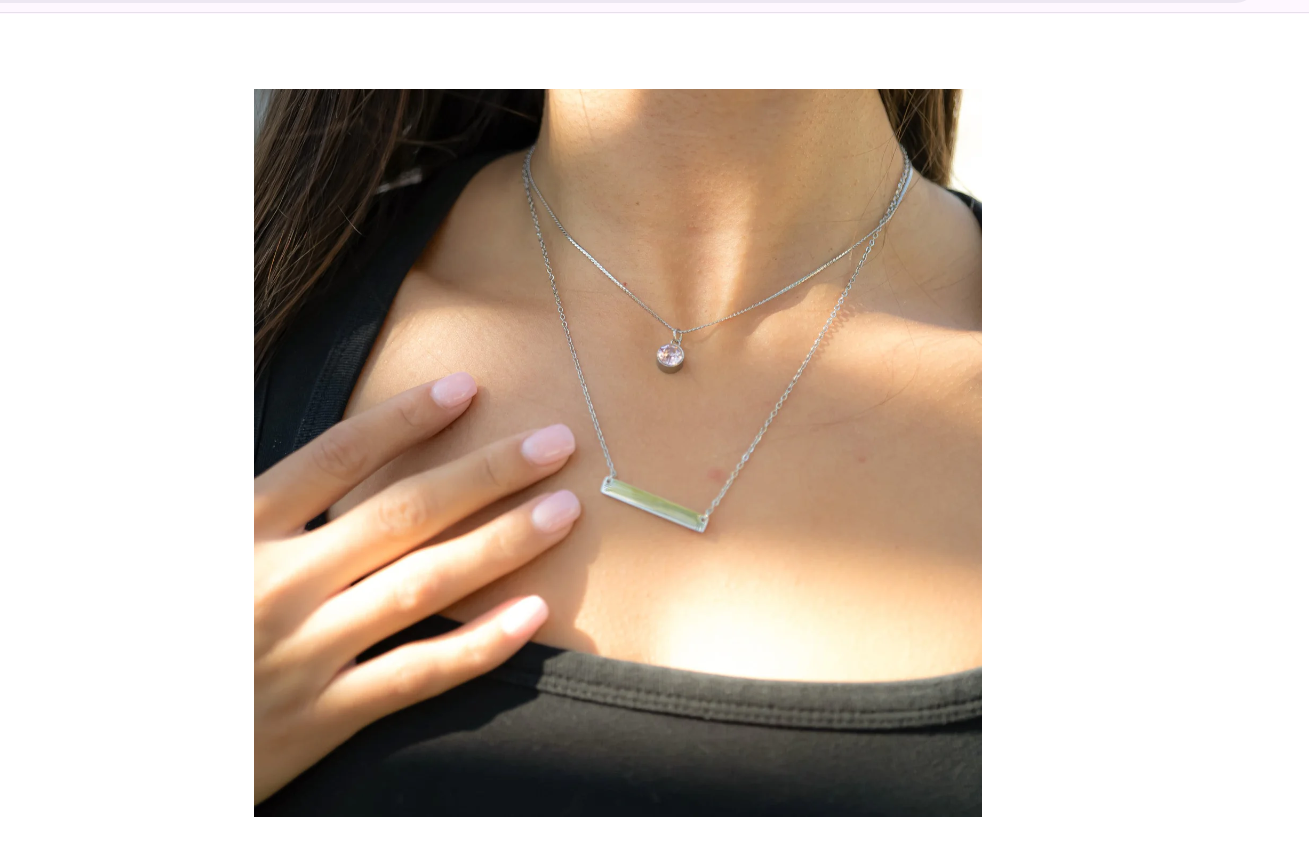 Person wearing a silver necklace