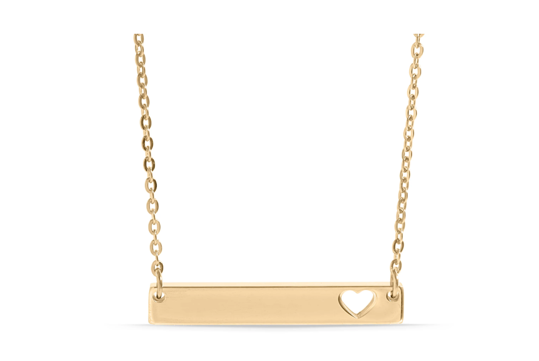Gold necklace with a bar pendant featuring a heart cutout. 