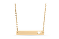 Gold necklace with a bar pendant featuring a heart cutout. 