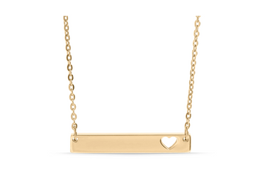 Gold necklace with a bar pendant featuring a heart cutout. 